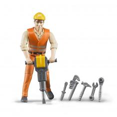 Figura de trabajador de la construcción con accesorios.
