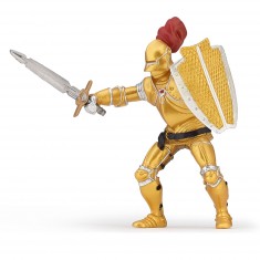 Figura de caballero dorado con armadura.