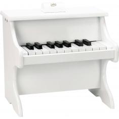 Piano blanco de 18 teclas con partitura.